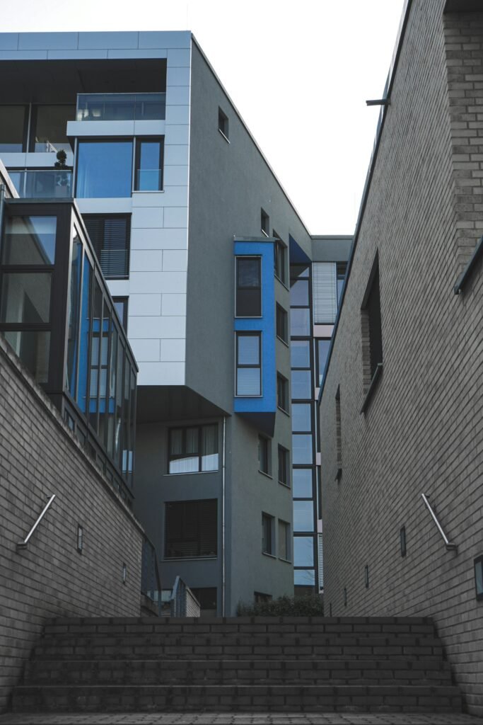 gray concrete building with blue windows